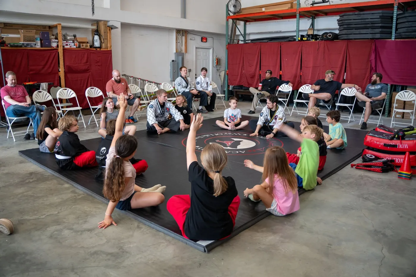 Kids sitting on the mat for a life-skills talk